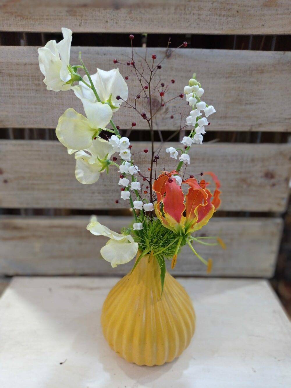 Composition muguet porte bonheur fleuriste neuville sur saone